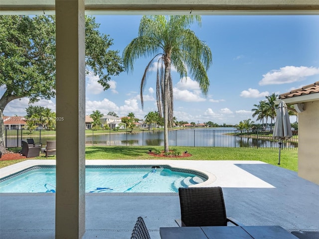 643 Lake Blvd, Weston, FL 33326 - view of swimming pool featuring a water view and a patio