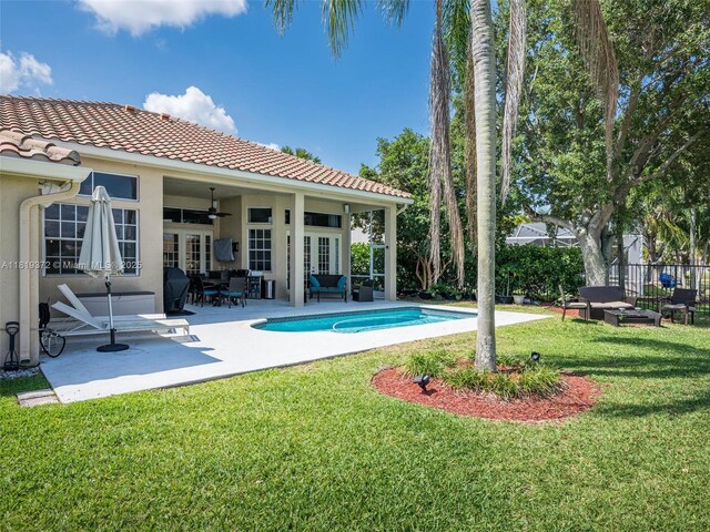 643 Lake Blvd, Weston, FL 33326 - view of pool featuring french doors, an outdoor living space, a ceiling fan, and a patio area