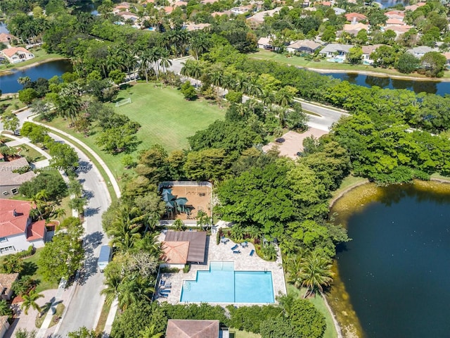 643 Lake Blvd, Weston, FL 33326 - aerial overview of property's location with a large body of water, nearby suburban area, a tree filled landscape, and a pool area