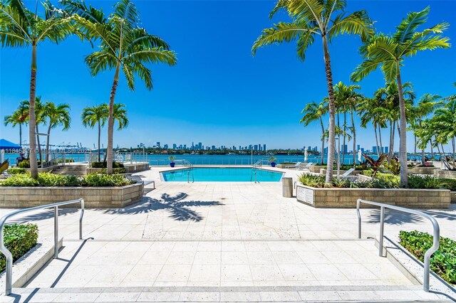 800 W Ave Unit 243, Miami Beach, FL 33139 - community pool featuring a patio and a view of skyline