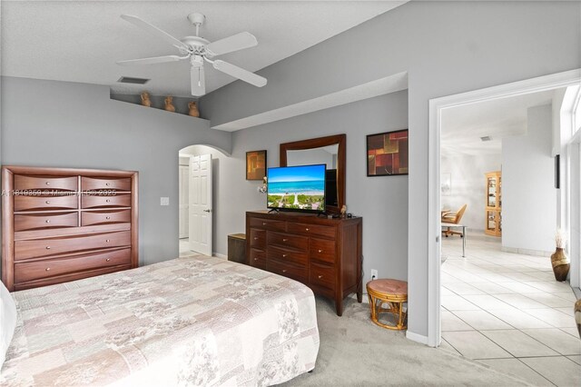 7182 Burgess Dr, Lake Worth, FL 33467 - bedroom with arched walkways, lofted ceiling, a ceiling fan, light carpet, and baseboards