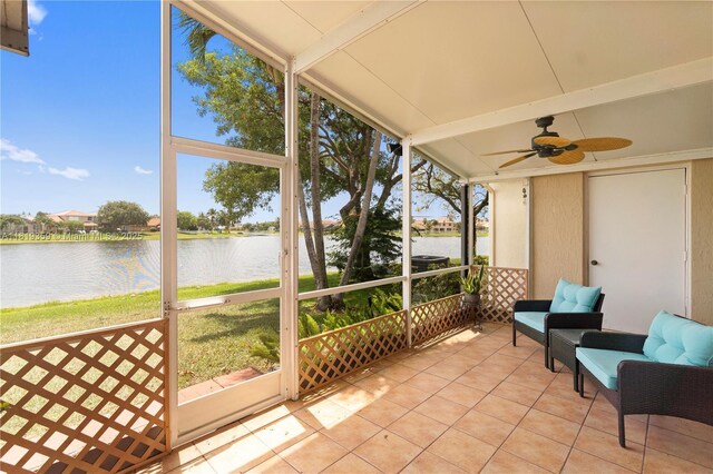 7182 Burgess Dr, Lake Worth, FL 33467 - sunroom featuring a water view, ceiling fan, and vaulted ceiling