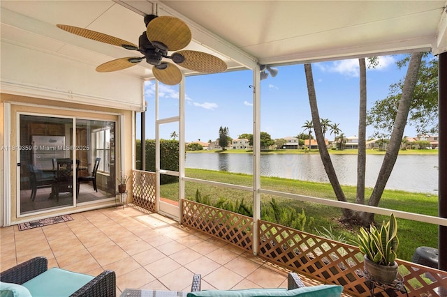 7182 Burgess Dr, Lake Worth, FL 33467 - unfurnished sunroom featuring a water view and a ceiling fan