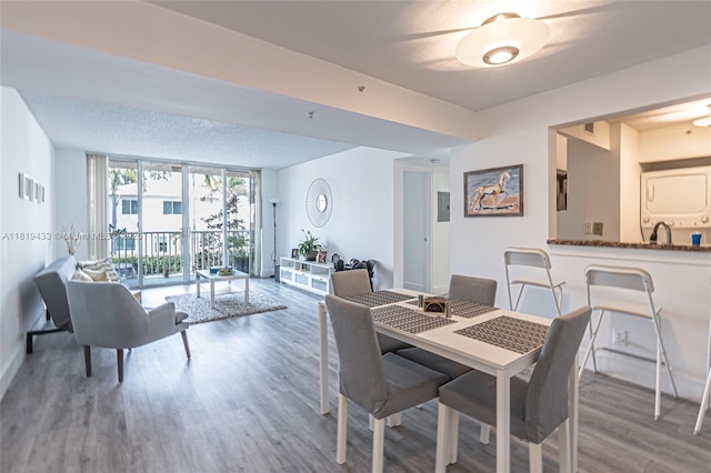 1450 SE 3rd Ave Unit 209, Dania Beach, FL 33004 - dining area with wood finished floors and baseboards