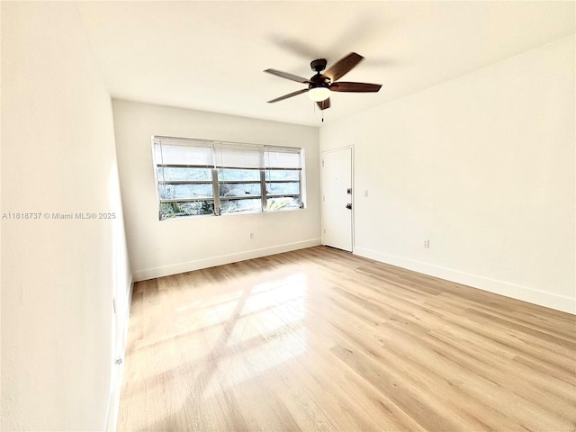 4740 Pine Tree Dr Unit 28, Miami Beach, FL 33140 - unfurnished room with ceiling fan, wood finished floors, and baseboards