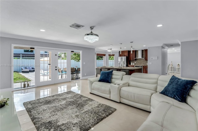 2635 SW 183rd Ave, Miramar, FL 33029 - living room featuring french doors, recessed lighting, light tile patterned floors, and crown molding