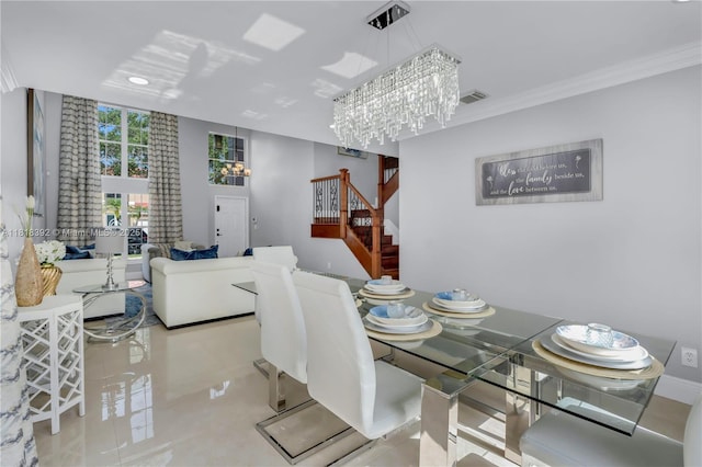2635 SW 183rd Ave, Miramar, FL 33029 - tiled dining space featuring a chandelier, stairway, and ornamental molding