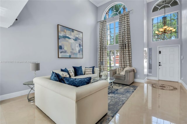 2635 SW 183rd Ave, Miramar, FL 33029 - living room featuring a towering ceiling, tile patterned floors, plenty of natural light, and a chandelier