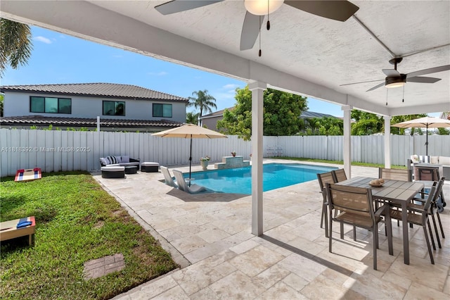 2635 SW 183rd Ave, Miramar, FL 33029 - view of swimming pool featuring ceiling fan, a fenced backyard, a patio, and outdoor dining area