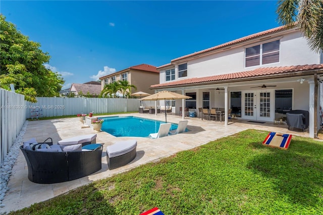 2635 SW 183rd Ave, Miramar, FL 33029 - view of swimming pool featuring ceiling fan, outdoor lounge area, french doors, a fenced backyard, and area for grilling