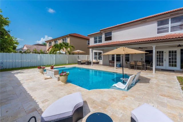 2635 SW 183rd Ave, Miramar, FL 33029 - view of swimming pool with french doors, ceiling fan, a fenced backyard, and a patio