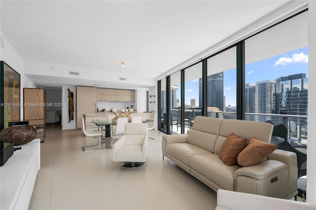 1300 S Miami Ave Unit 2305, Miami, FL 33130 - living area with expansive windows, a view of skyline, and light tile patterned floors