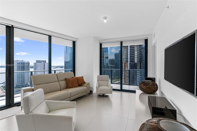 1300 S Miami Ave Unit 2305, Miami, FL 33130 - living area featuring a wall of windows, healthy amount of natural light, tile patterned floors, and a city view