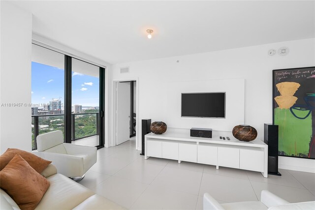 1300 S Miami Ave Unit 2305, Miami, FL 33130 - living room featuring a wall of windows, a city view, and light tile patterned flooring