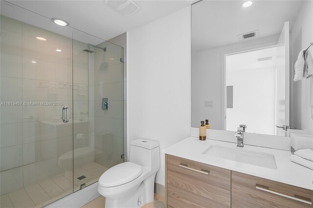 1300 S Miami Ave Unit 2305, Miami, FL 33130 - full bath featuring toilet, vanity, a stall shower, and recessed lighting
