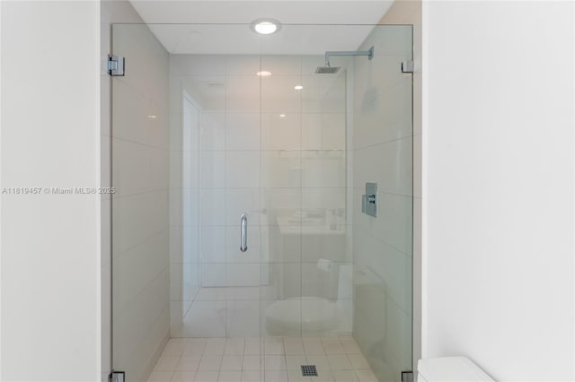 1300 S Miami Ave Unit 2305, Miami, FL 33130 - bathroom featuring toilet, a stall shower, and tile patterned floors