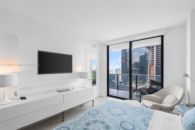 1300 S Miami Ave Unit 2305, Miami, FL 33130 - bedroom with floor to ceiling windows, access to exterior, and light tile patterned flooring