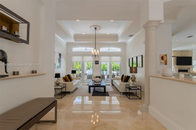 9532 SW 124th Ter, Miami, FL 33176 - living room with a tray ceiling, a towering ceiling, recessed lighting, ornate columns, and crown molding