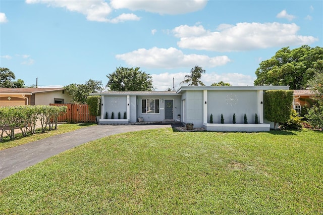 2375 NW 81st Ave, Sunrise, FL 33322 - view of front of house featuring stucco siding and asphalt driveway