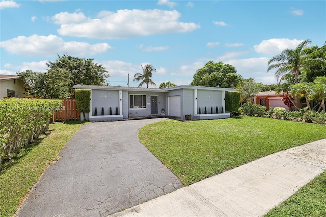 2375 NW 81st Ave, Sunrise, FL 33322 - view of front of house with asphalt driveway, stucco siding, and an attached garage