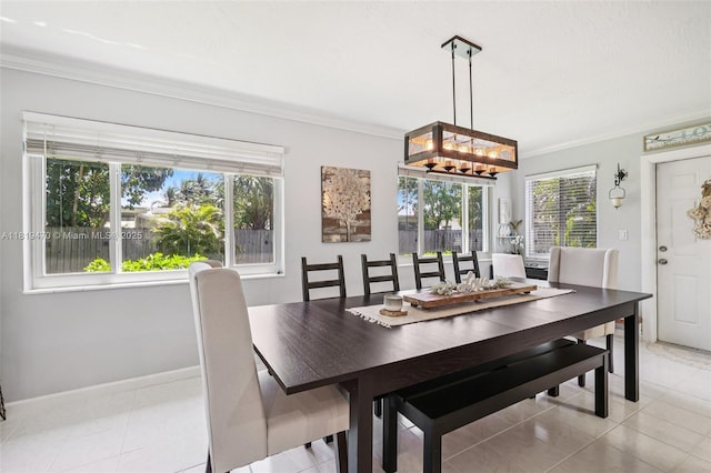 2375 NW 81st Ave, Sunrise, FL 33322 - dining space featuring healthy amount of natural light, ornamental molding, a chandelier, and light tile patterned floors