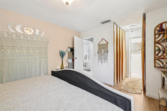 2375 NW 81st Ave, Sunrise, FL 33322 - bedroom featuring wood finished floors and baseboards