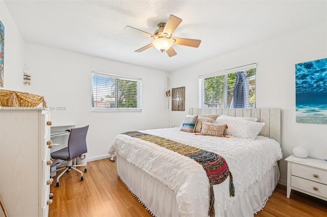 2375 NW 81st Ave, Sunrise, FL 33322 - bedroom with light wood finished floors, a ceiling fan, and a desk