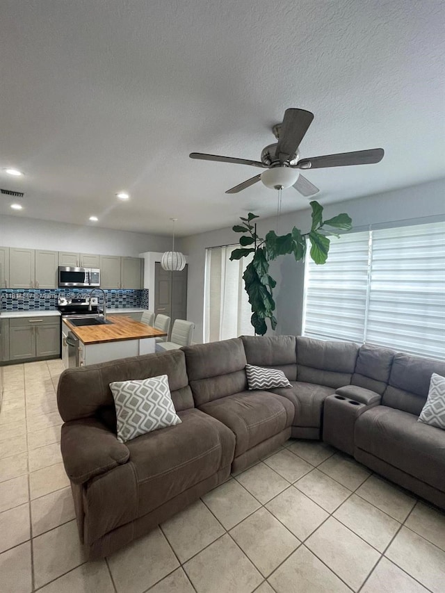 18796 SW 27th Ct, Miramar, FL 33029 - living room featuring light tile patterned floors, a ceiling fan, and recessed lighting