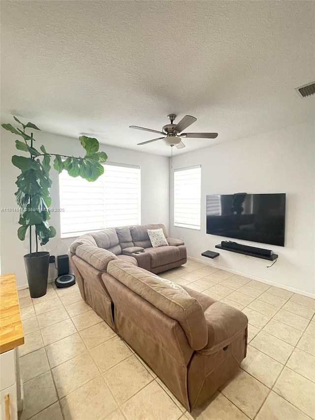 18796 SW 27th Ct, Miramar, FL 33029 - living room featuring light tile patterned flooring, a ceiling fan, and a textured ceiling