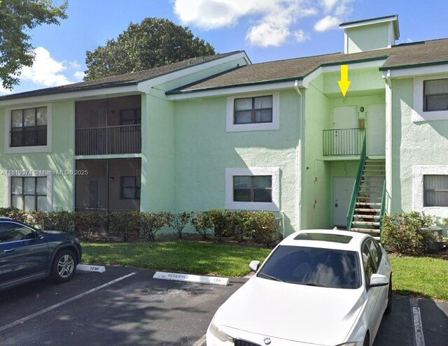 4011 NW 87th Ave Unit 4011, Sunrise, FL 33351 - view of building exterior featuring uncovered parking and stairs
