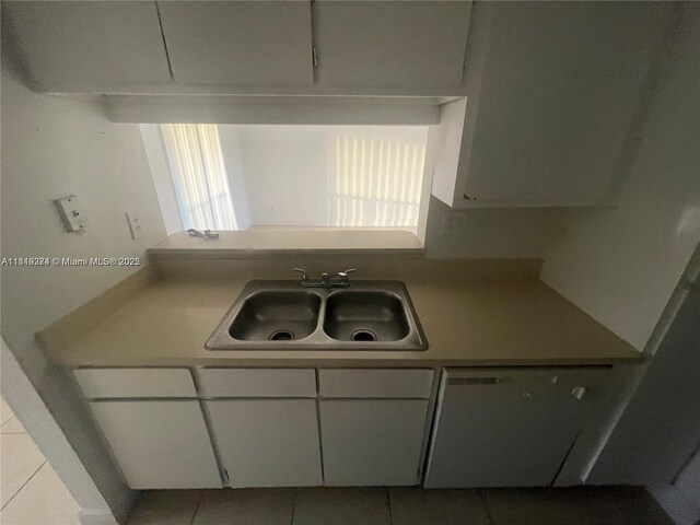 4011 NW 87th Ave Unit 4011, Sunrise, FL 33351 - kitchen with a sink, white cabinets, light countertops, and tile patterned floors