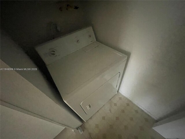 4011 NW 87th Ave Unit 4011, Sunrise, FL 33351 - laundry room featuring washer / dryer and tile patterned floors