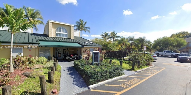 4011 NW 87th Ave Unit 4011, Sunrise, FL 33351 - view of building exterior featuring uncovered parking