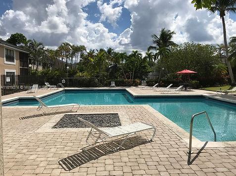 4011 NW 87th Ave Unit 4011, Sunrise, FL 33351 - community pool featuring a patio