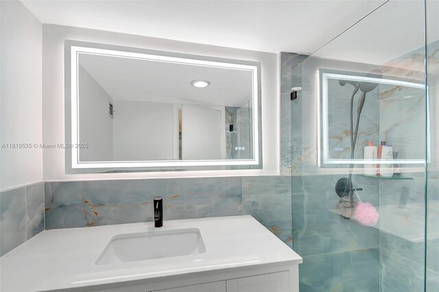 3015 N Ocean Blvd Unit 4K, Fort Lauderdale, FL 33308 - full bath featuring vanity, tile walls, and a marble finish shower