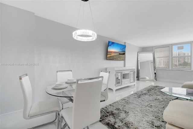 3015 N Ocean Blvd Unit 4K, Fort Lauderdale, FL 33308 - dining space with a chandelier
