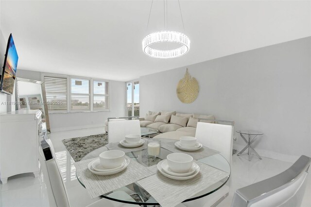 3015 N Ocean Blvd Unit 4K, Fort Lauderdale, FL 33308 - dining area featuring a chandelier