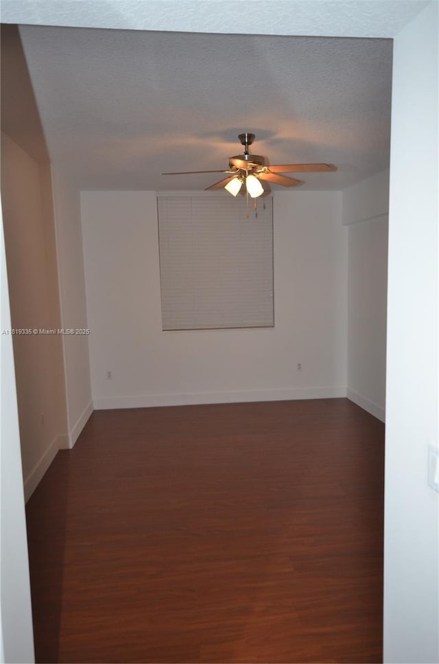 400 N Federal Hwy Unit 302S, Boynton Beach, FL 33435 - spare room with dark wood-style floors, ceiling fan, and baseboards