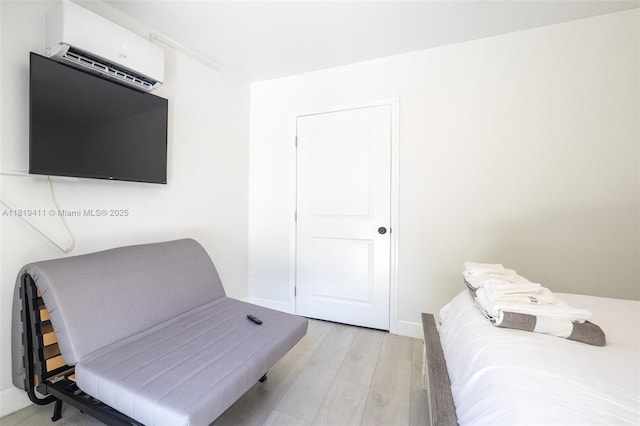 806 Argonaut Is, Dania Beach, FL 33004 - bedroom with a wall unit AC and light wood-type flooring