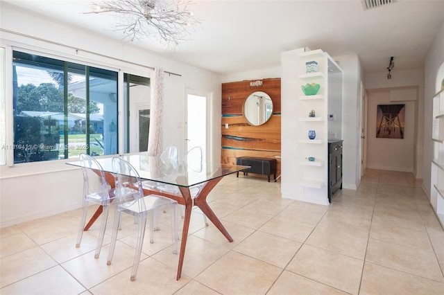 806 Argonaut Is, Dania Beach, FL 33004 - dining space featuring a chandelier, light tile patterned flooring, and baseboards