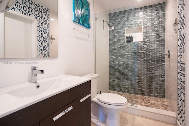 806 Argonaut Is, Dania Beach, FL 33004 - bathroom with vanity, a tile shower, toilet, and tile patterned floors