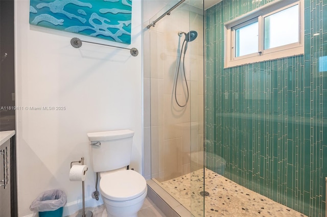 806 Argonaut Is, Dania Beach, FL 33004 - full bathroom featuring a tile shower, toilet, baseboards, tile patterned floors, and vanity