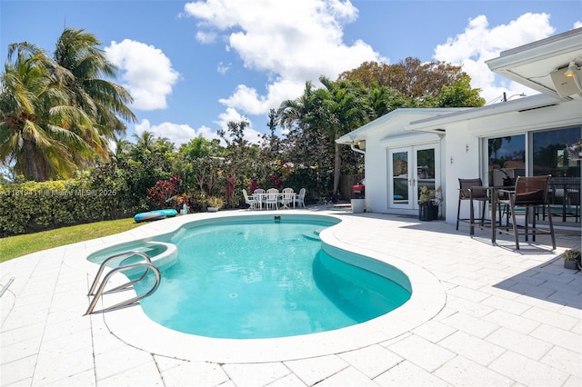 806 Argonaut Is, Dania Beach, FL 33004 - view of swimming pool featuring a patio, outdoor dining area, and french doors