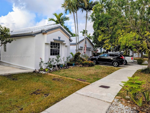 15640 SW 98th St, Miami, FL 33196 - view of property exterior featuring a yard, stucco siding, and a tile roof