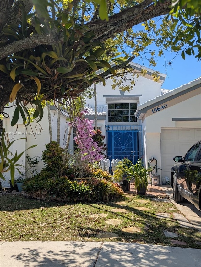 15640 SW 98th St, Miami, FL 33196 - view of front facade featuring a garage and stucco siding