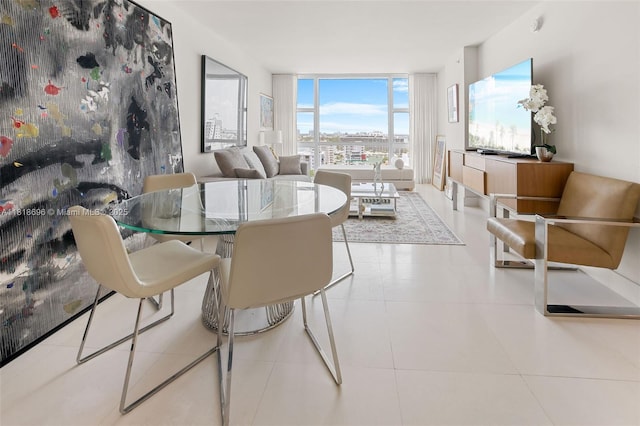 6801 Collins Ave Unit 1401, Door Number Miami Beach, FL 33141 - dining area featuring expansive windows and tile patterned flooring