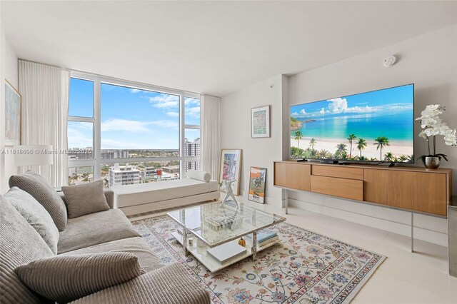 6801 Collins Ave Unit 1401, Door Number Miami Beach, FL 33141 - tiled living room with floor to ceiling windows