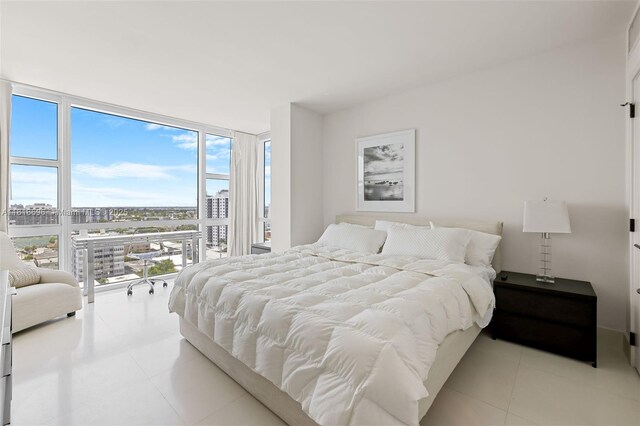 6801 Collins Ave Unit 1401, Door Number Miami Beach, FL 33141 - bedroom featuring expansive windows, multiple windows, and a city view