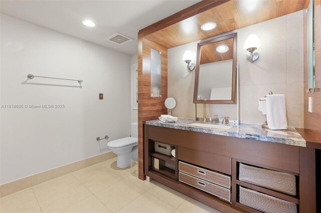 6801 Collins Ave Unit 1401, Door Number Miami Beach, FL 33141 - bathroom with vanity, toilet, recessed lighting, and baseboards