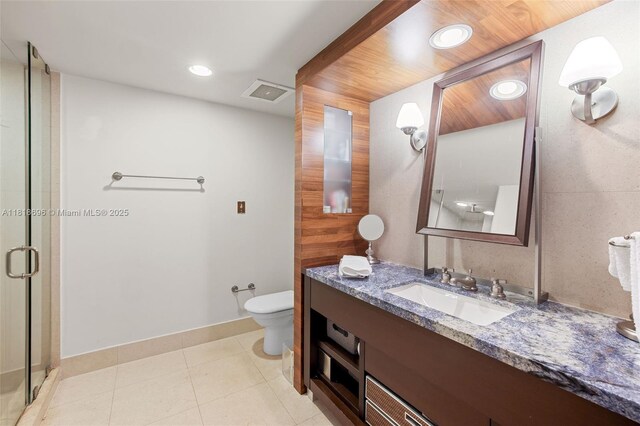 6801 Collins Ave Unit 1401, Door Number Miami Beach, FL 33141 - bathroom with toilet, vanity, a shower stall, recessed lighting, and tile patterned floors